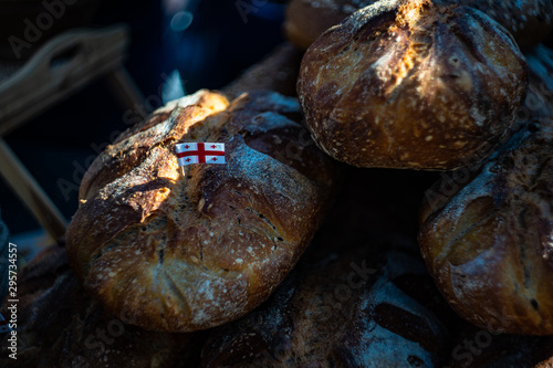 Fototapeta Naklejka Na Ścianę i Meble -  Bakery concept with  gold rustic crusty loaves of bread and buns