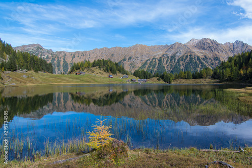 idyllic view of the alps with reflection in the lake