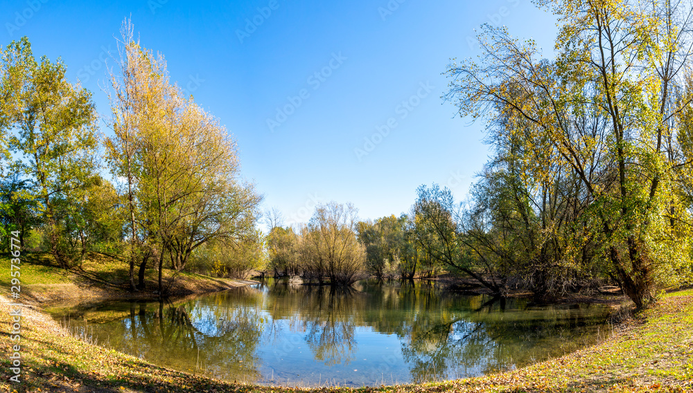 Panorama of a western side of a lake during autumn season in Bundek city park, Zagreb, Croatia Panorama of a western side of a lake during autumn season in Bundek city park, Zagreb, Croatia