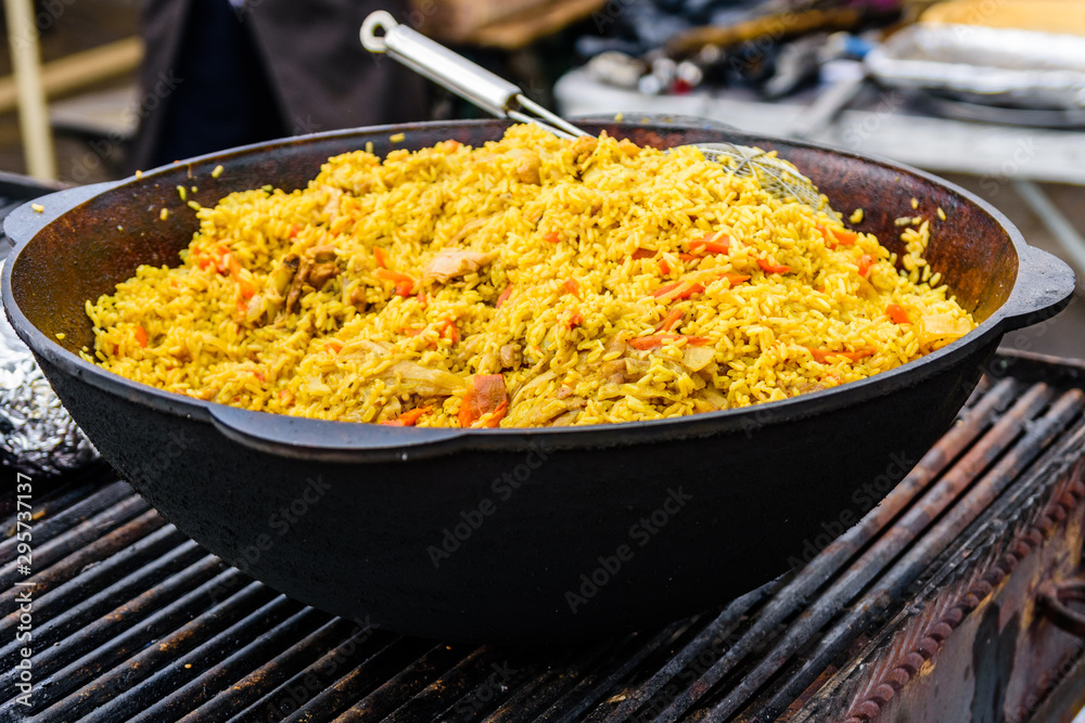 Big pan with pilaf on street festival