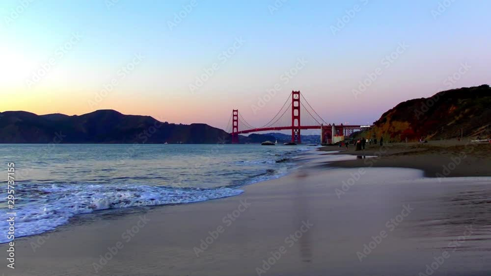 The Golden Gate Bridge as seen from Baker Beach at sunset, San Francisco, California, USA
