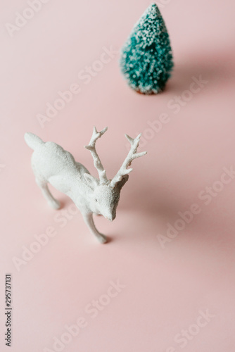 Fototapeta Naklejka Na Ścianę i Meble -  Reindeer toy and pine tree, holiday composition