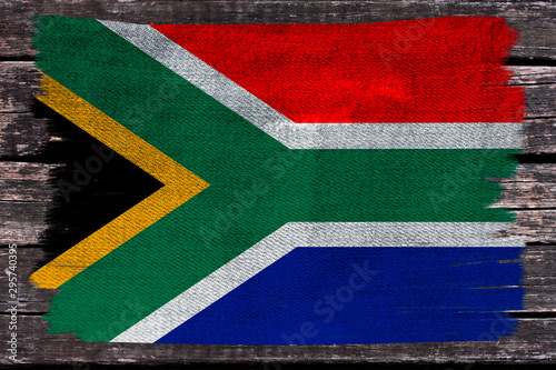 photo of the beautiful colored national flag of the state of South Africa on textured fabric, concept of tourism, economy and politics, closeup