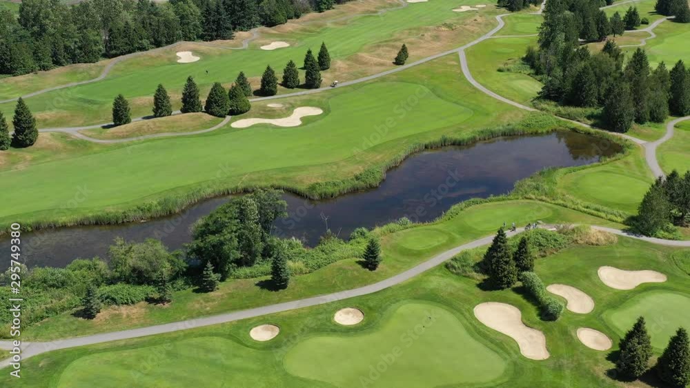 Golf course with gorgeous green and fantastic forest view. Aerial. 4K. Golf course with gorgeous green and fantastic forest view. Aerial. 4K.