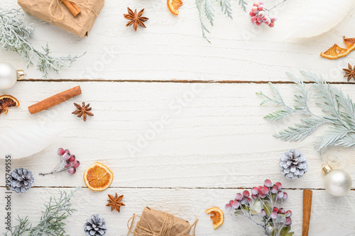 Christmas composition or Christmas on a white wooden background.Gifts and Christmas tree branches.