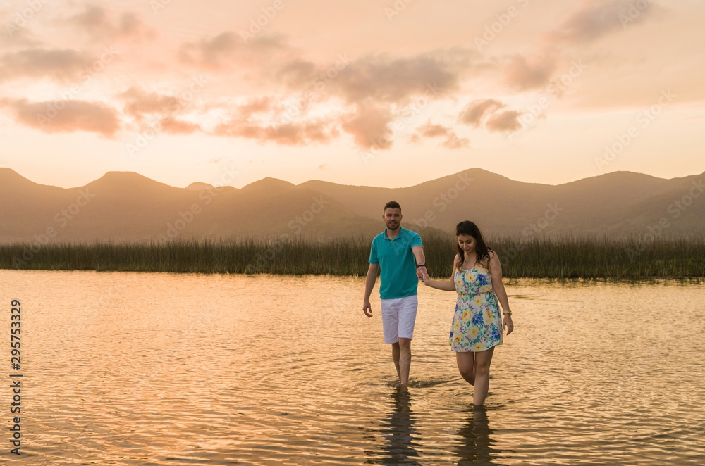Fototapeta premium Pre wedding couple and amazing landscape in Torres beach.