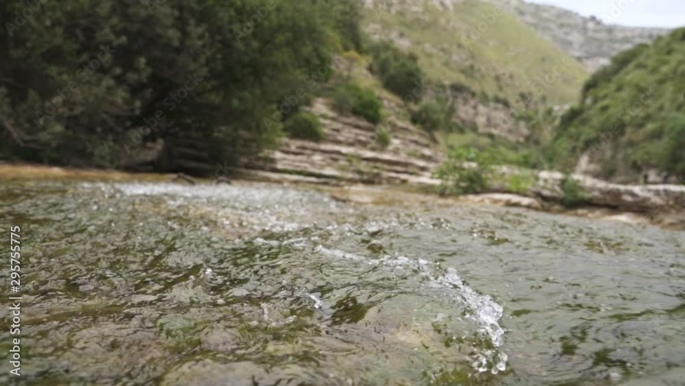 River stream flows in slow motion in Nature Reserve Cavagrande, Sicily River stream flows in slow motion in Nature Reserve Cavagrande, Sicily