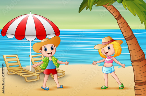 Funny children on the beach in a straw hat