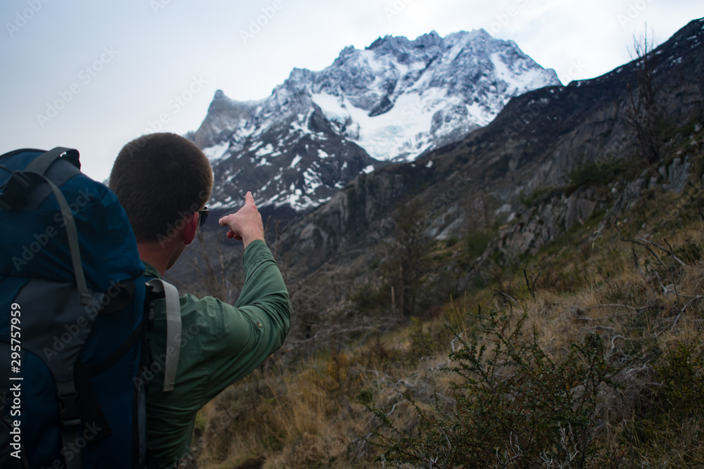  Hiker Pointing At Patagonia Mountain Peak Torres del Paine National Park, Chile