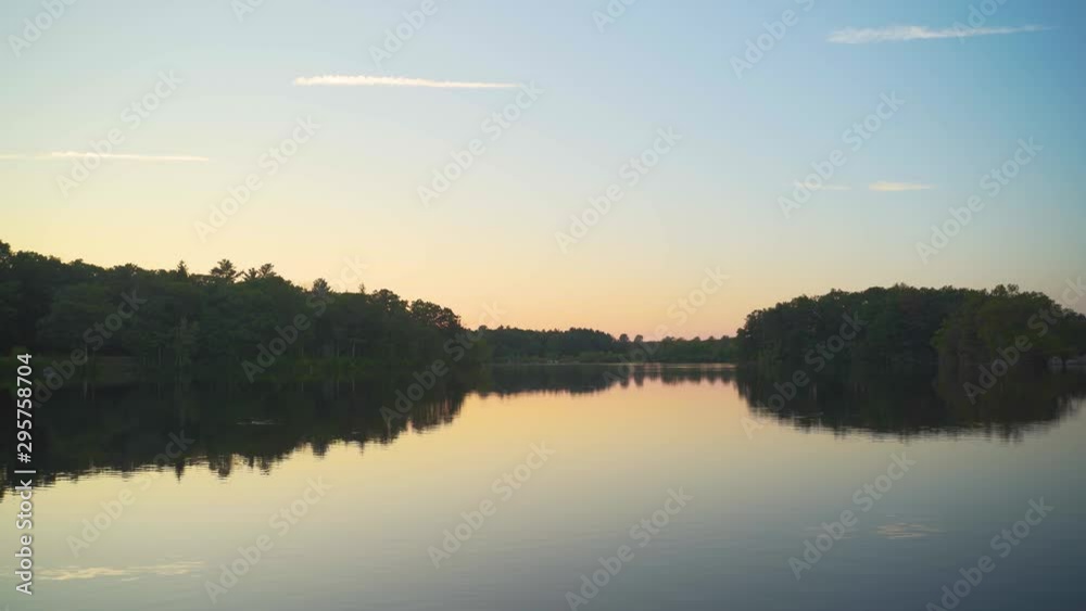 Calm scenic river during a sunset on a quiet peaceful evening Calm scenic river during a sunset on a quiet peaceful evening