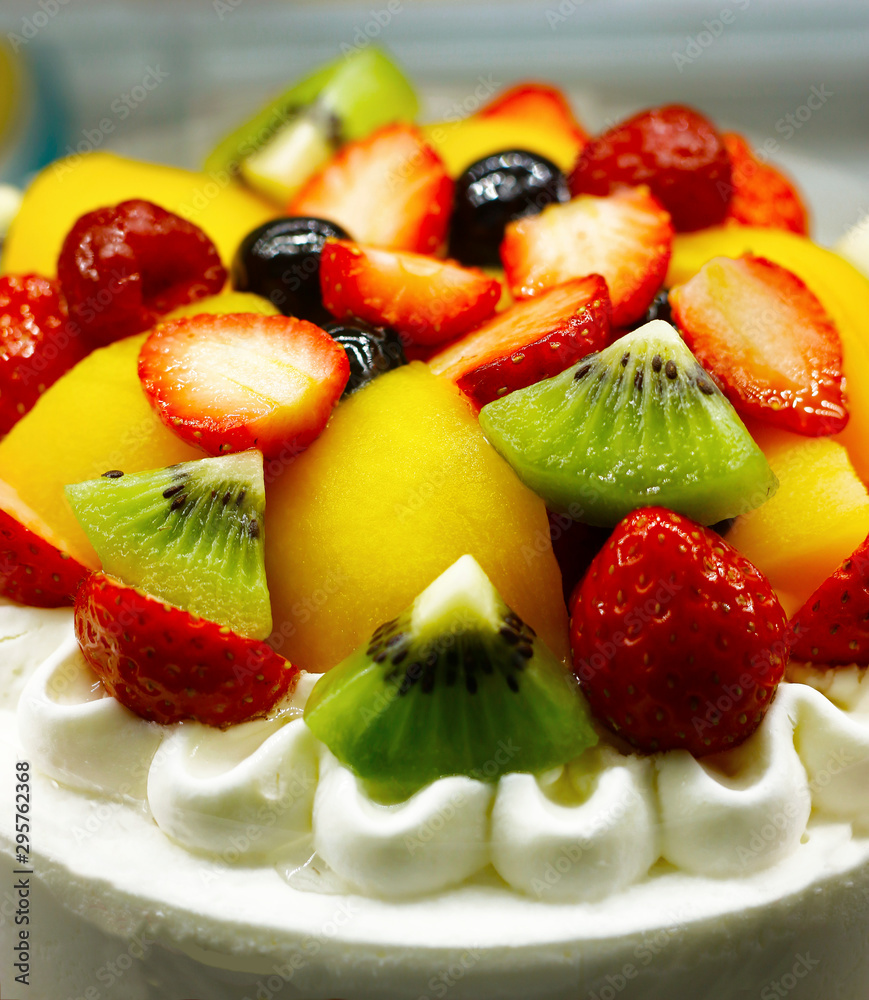 close up of fruit cake with whipped cream close up of fruit cake with whipped cream