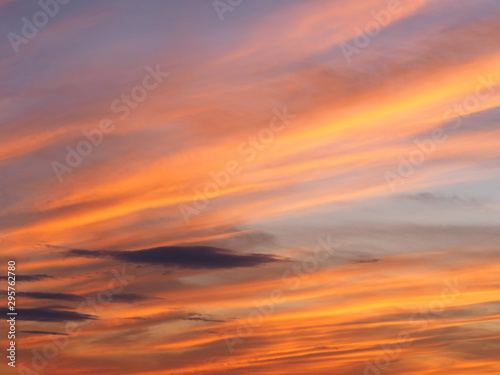 Fototapeta Naklejka Na Ścianę i Meble -  Clouds on a sky background illuminated by the sun's rays of the setting sun
