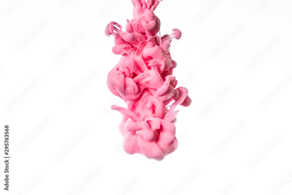Obraz premium Colorful ink in water isolated on white background. Abstract pink paint splash.