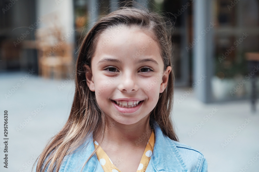 Headshot portrait of confident, happy and healthy young mixed race girl  smiling and looking at camera Stock Photo | Adobe Stock