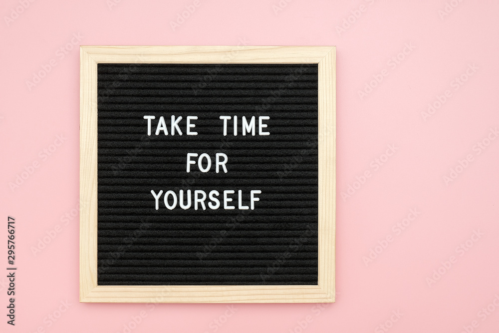 Fototapeta Take time for yourself. Motivational quote on letterboard on pink background. Top view Flat lay Copy space Concept inspirational quote of the day