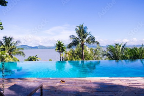 Landscape of beautiful swimming pool beside the sea. © Phonpimon