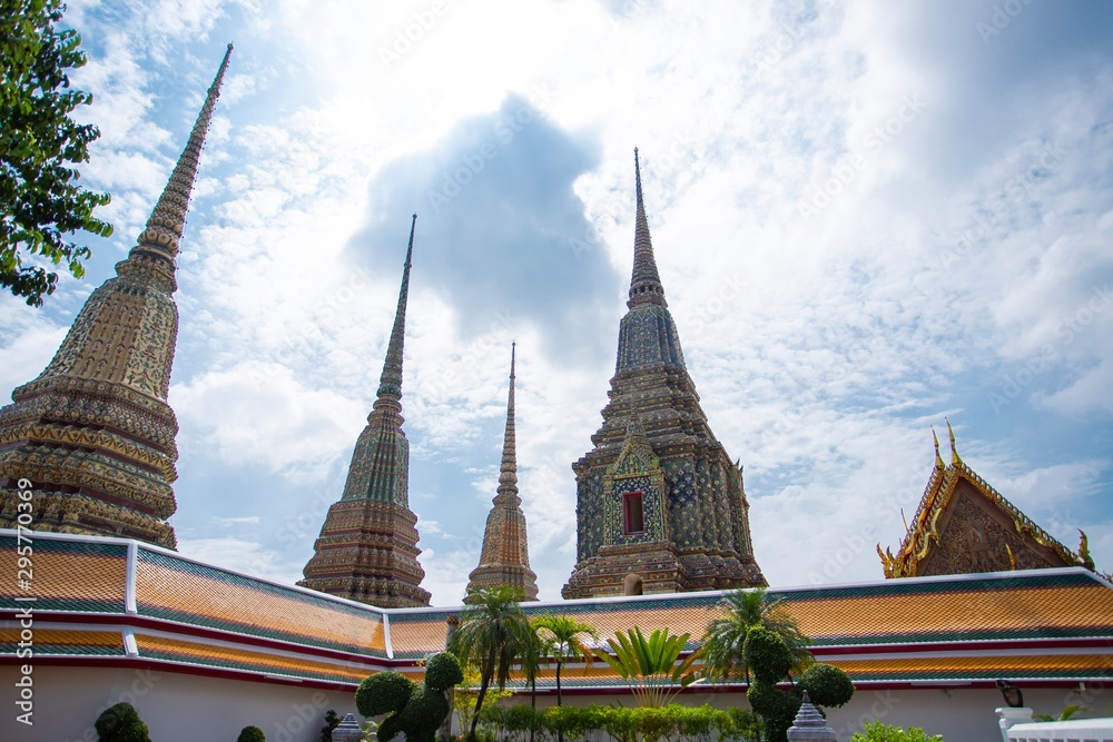 Fototapeta premium Beautiful pagodas in Wat Pho under clear sky