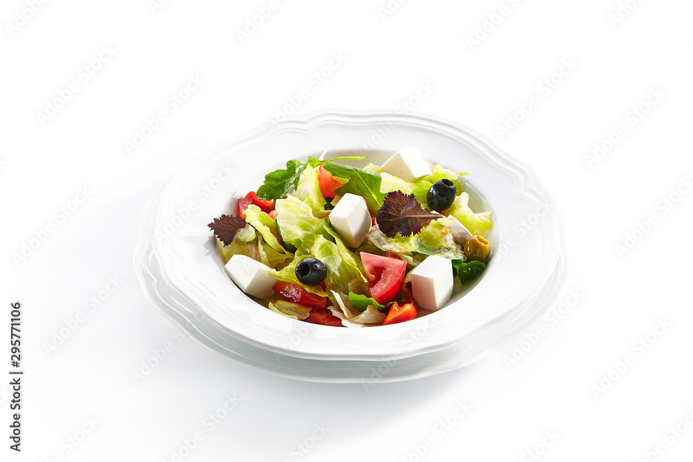 Macro Shot of Greek Salad in Light Plate Isolated on White Background Macro Shot of Greek Salad in Light Plate Isolated on White Background
