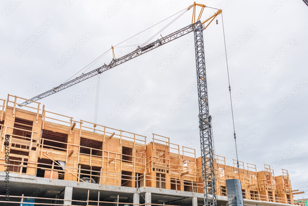 Building under construction. The site with crane.