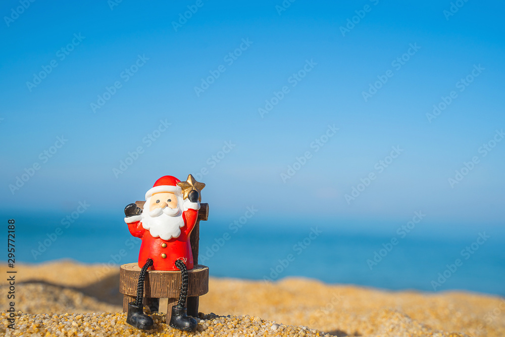 Christmas Santa hold star.on the beach are texture Nature background creative bokeo tropical layout made at phuket Thailand Christmas Santa hold star.on the beach are texture Nature background creative bokeo tropical layout made at phuket Thailand