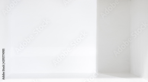 Wallpaper Mural The image of light and shadow falling inside a white room with empty space Torontodigital.ca