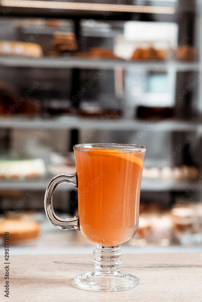 Orange autumn drink with spices in the cafe. Orange autumn drink with spices in the cafe.