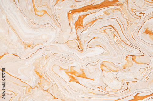 Caramel dynamic and fluid raster texture. Abstract acrylic paints mixt color background. Dyeing, liquid flow surface modern design. Orange and white contrast pigments, watercolor wallpaper. photo