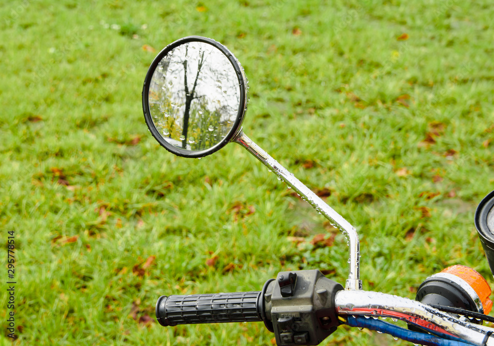 motorcycle rear view mirror on grass background motorcycle rear view mirror on grass background