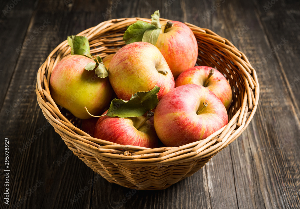 Freshly harvested ripe apple on the rustic wooden background. Selective focus. Shallow depth of field. Freshly harvested ripe apple on the rustic wooden background. Selective focus. Shallow depth of field.
