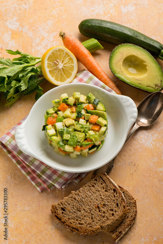 tartar salad with avocado carrots zucchinis and celery