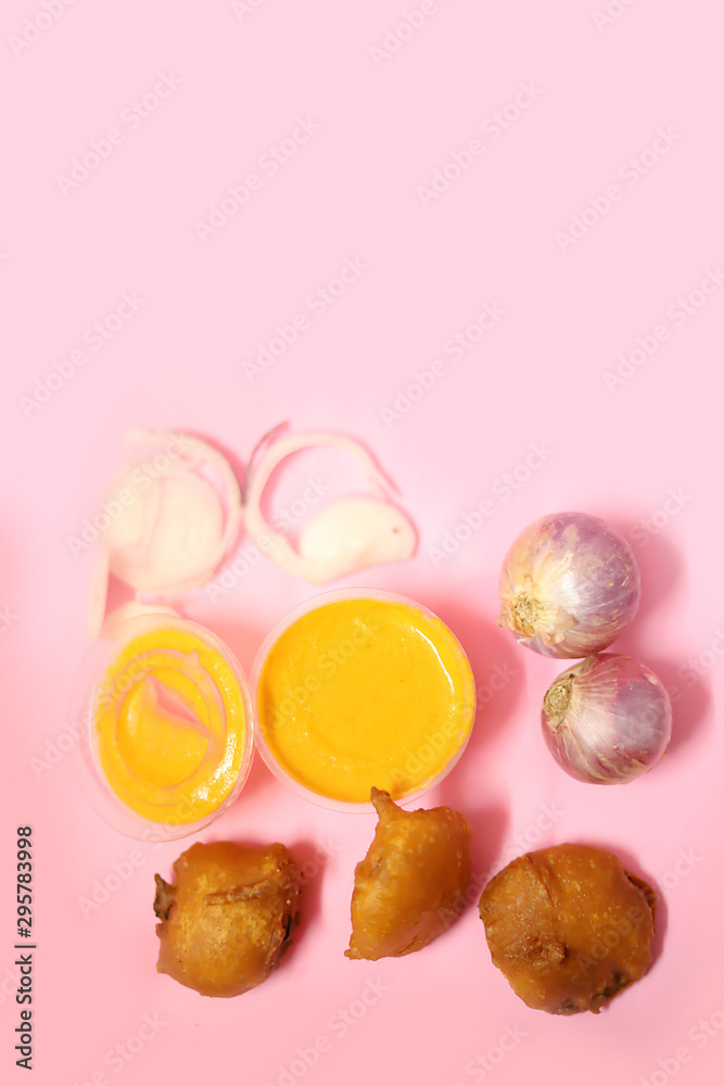 Top view of Onion Bhajji is a spicy Indian snack of chopped onions fried in dough Top view of Onion Bhajji is a spicy Indian snack of chopped onions fried in dough
