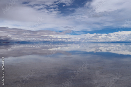 The Salar de Uyuni flooded after the rains, Bolivia. Clouds reflected in the water of the Salar de Uyuni, Bolivia