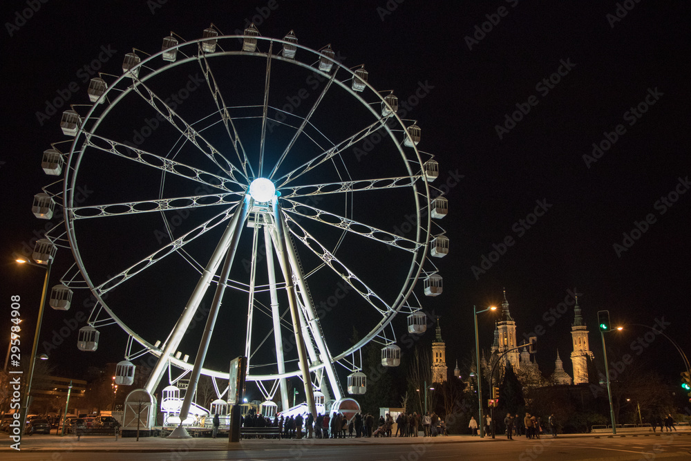 night ferris wheel illuminated with lights