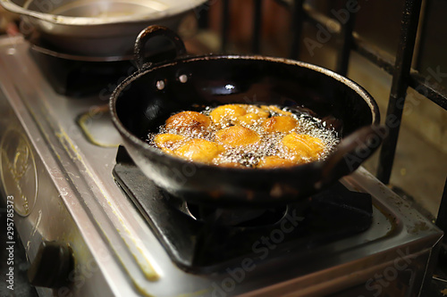 Onion bajji, deep fried onion bhajis in a home kitchen