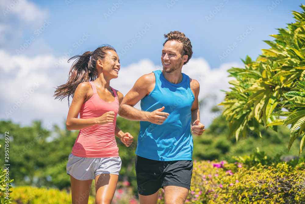 Smiling Young Couple Training Outside Together · Free Stock Photo