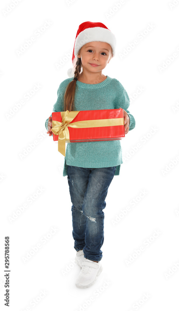 Cute little girl in Santa hat with Christmas gift on white background Cute little girl in Santa hat with Christmas gift on white background
