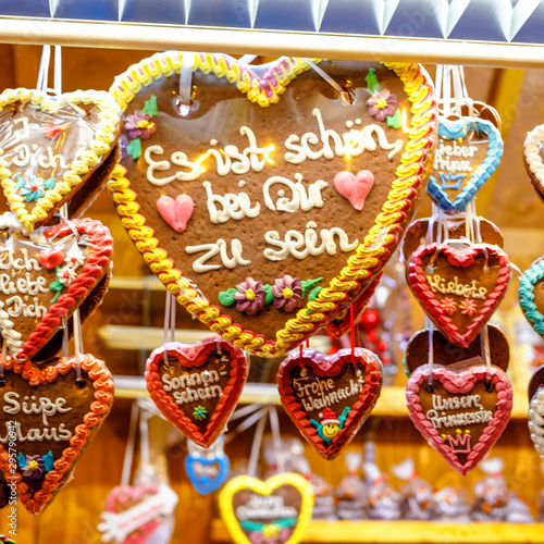 Gingerbread Hearts at German Christmas Market. Nuremberg, Munich, Fulda, Berlin, Hamburg xmas market in Germany. In German language It is beautiful to be with you.