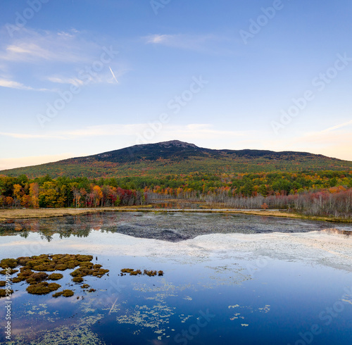Aerial view of beautiful Mt Monadnock over pond with reflection on water surface