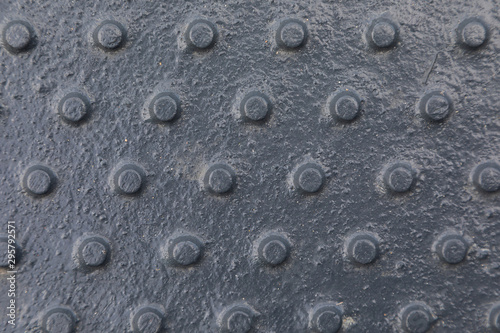 Close-up of shiny dark tactile surface with pimps