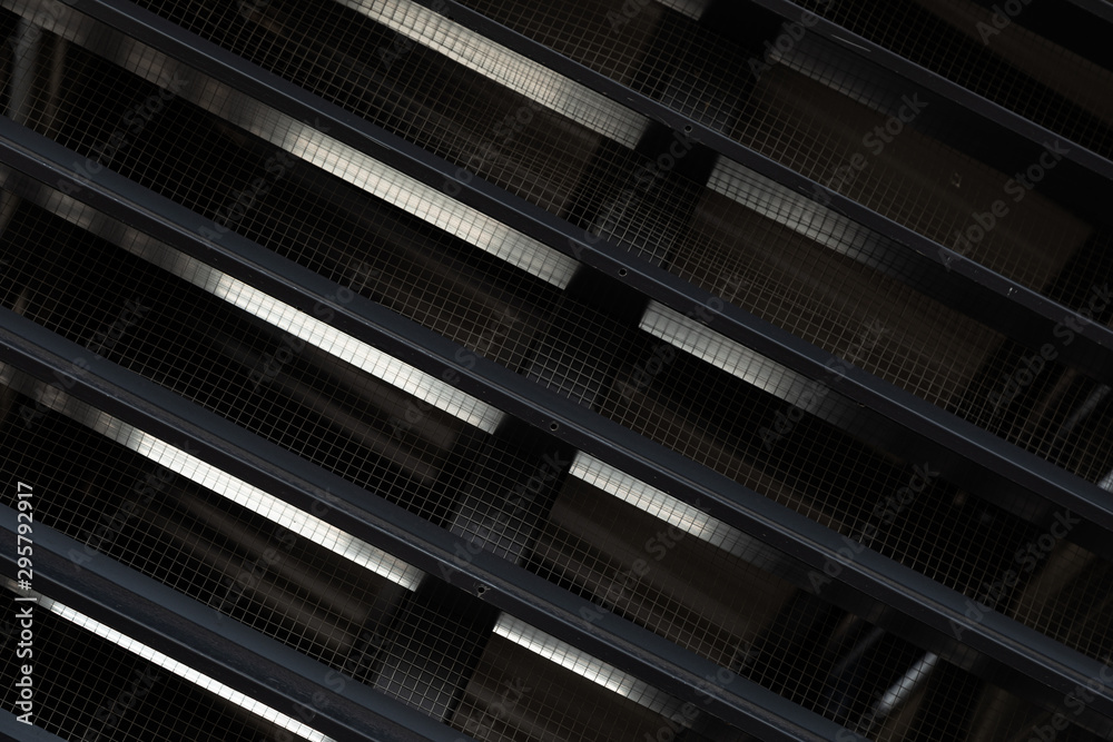 Close-up of a black ventilation grille with gaps Close-up of a black ventilation grille with gaps