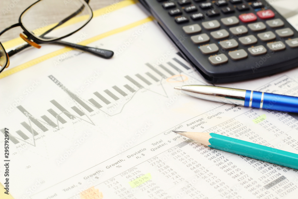 Business concept with a report and a calculator Business concept with a report and a calculator