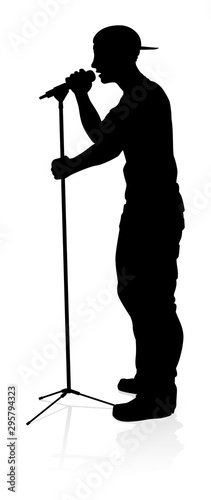 A singer pop, country music, rock star or hiphop rapper artist vocalist singing in silhouette