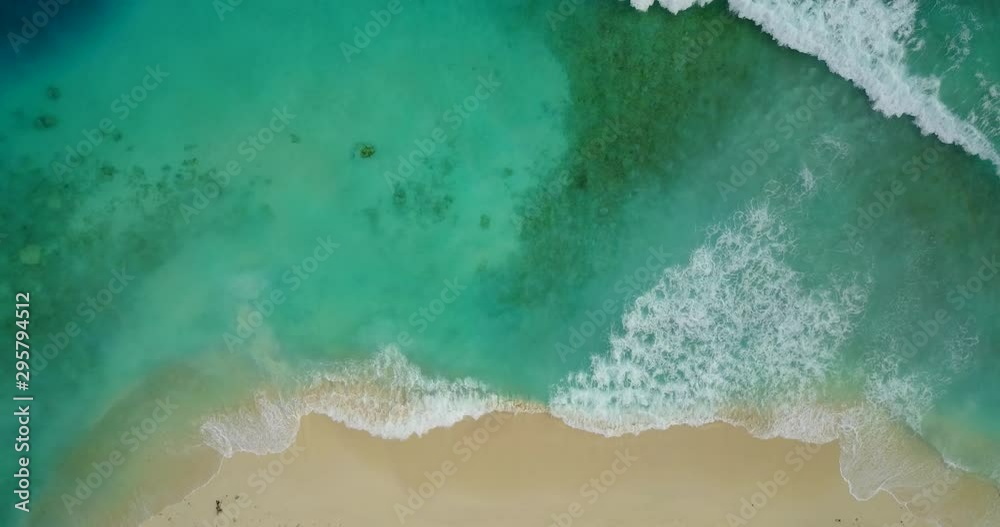 look down view showing big waves splashing to the sand of the seashore, fascinating scenery
look down view showing big waves splashing to the sand of the seashore, fascinating scenery
