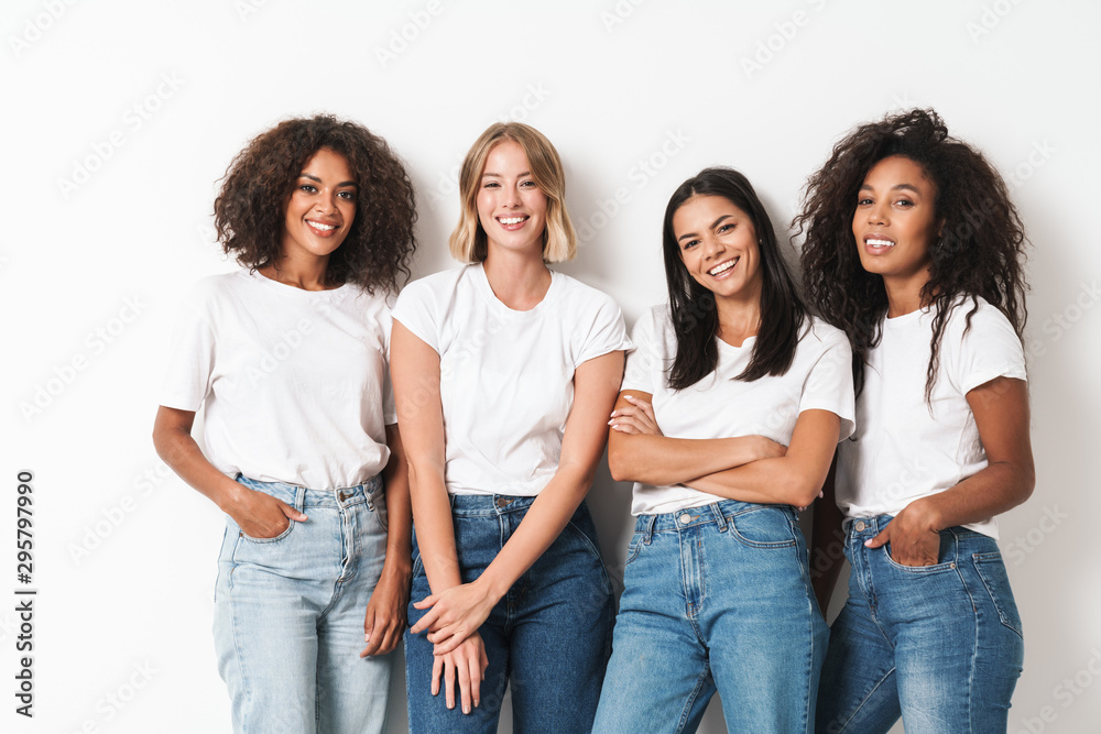 Optimistic cheery young women multiracial friends - obrazy, fototapety, plakaty 