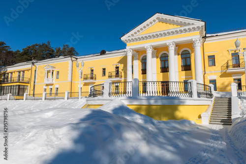MOSCOW REGION, RUSSIA - MARCH 2, 2019: Country Hotel Bor on a winter day. Located on a hilltop in a coniferous forest on the banks of the river Rozhayka
