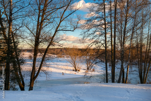 View from the shore on a frozen river on a winter day