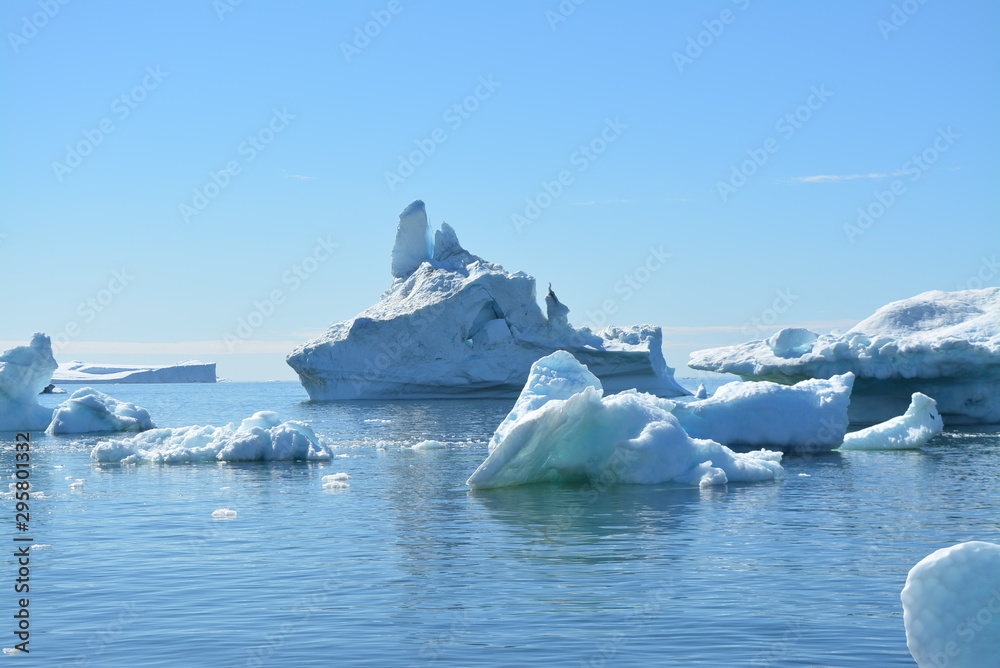 great views over ice fjord in Ilulissat Greenland - beautiful icebergs in the Disko Bay / Baffin Bay - blue sky, ice sea great views over ice fjord in Ilulissat Greenland - beautiful icebergs in the Disko Bay / Baffin Bay - blue sky, ice sea