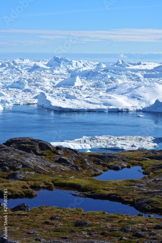 great views over ice fjord in Ilulissat Greenland - beautiful icebergs in the Disko Bay / Baffin Bay - blue sky, ice sea