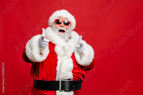 Choose winter season sales. Close up photo of cool stylish trendy santa indicate discount shopping bargain wear eyeglasses eyewear cap hat isolated over red background