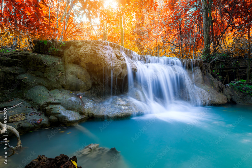 Amazing in nature, beautiful waterfall at colorful autumn forest in fall season